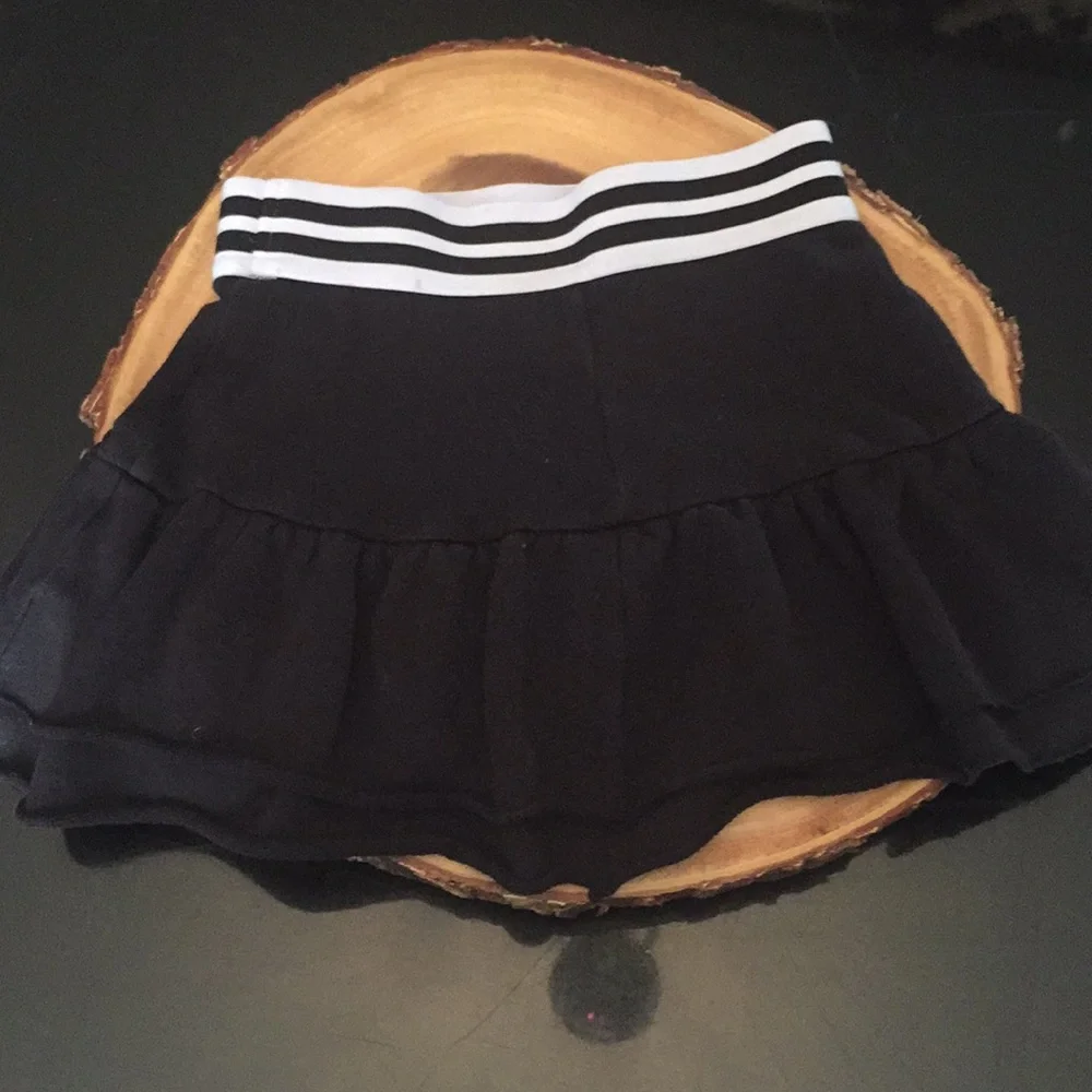 Justice skort black with white stripes on waist‎ band size 6/7
